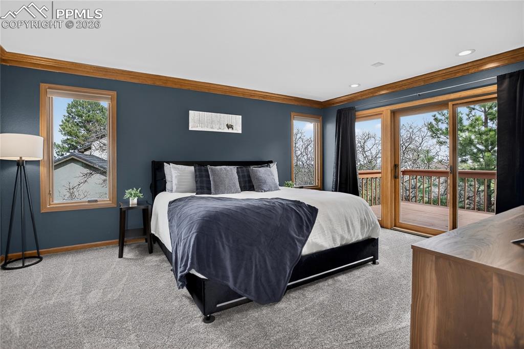 Image 16 of 42: Main-level primary suite w/ walk-out