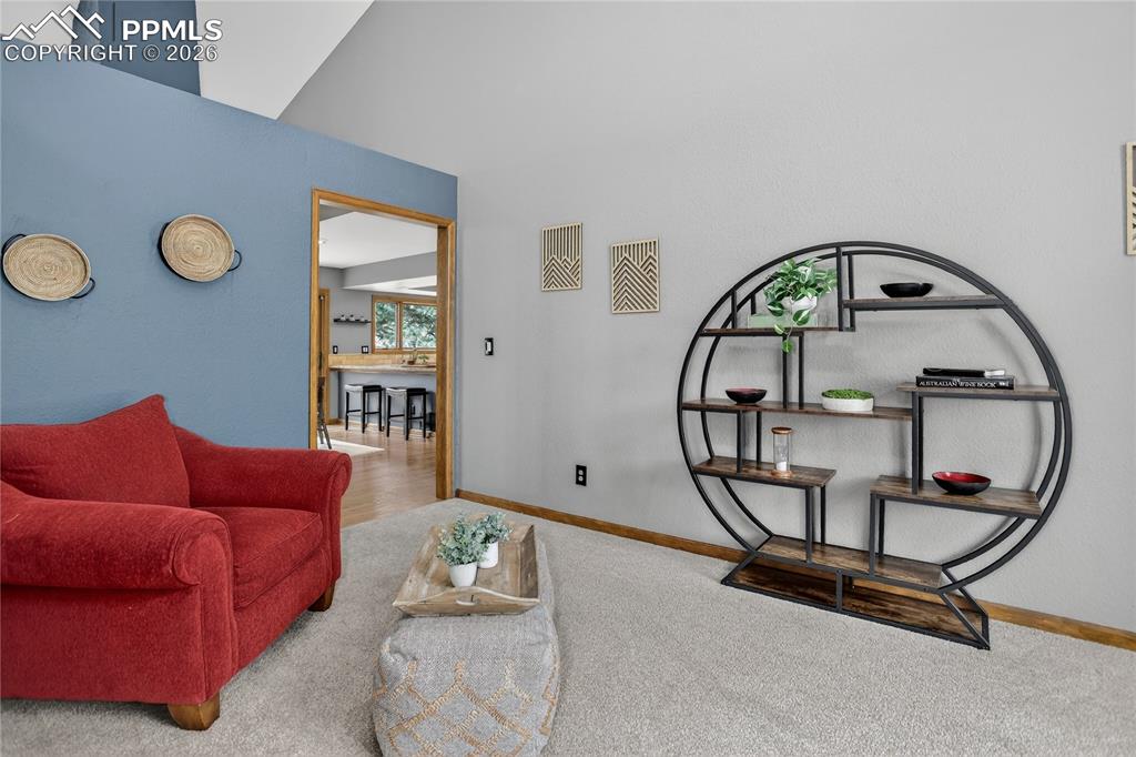 Image 24 of 42: Featuring baseboards and light colored carpet