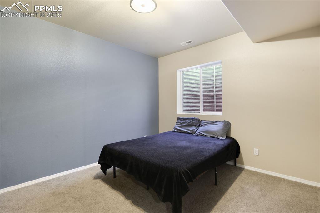 Image 30 of 39: Bedroom