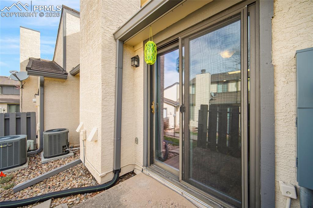Image 16 of 31: Entrance to property featuring stucco siding