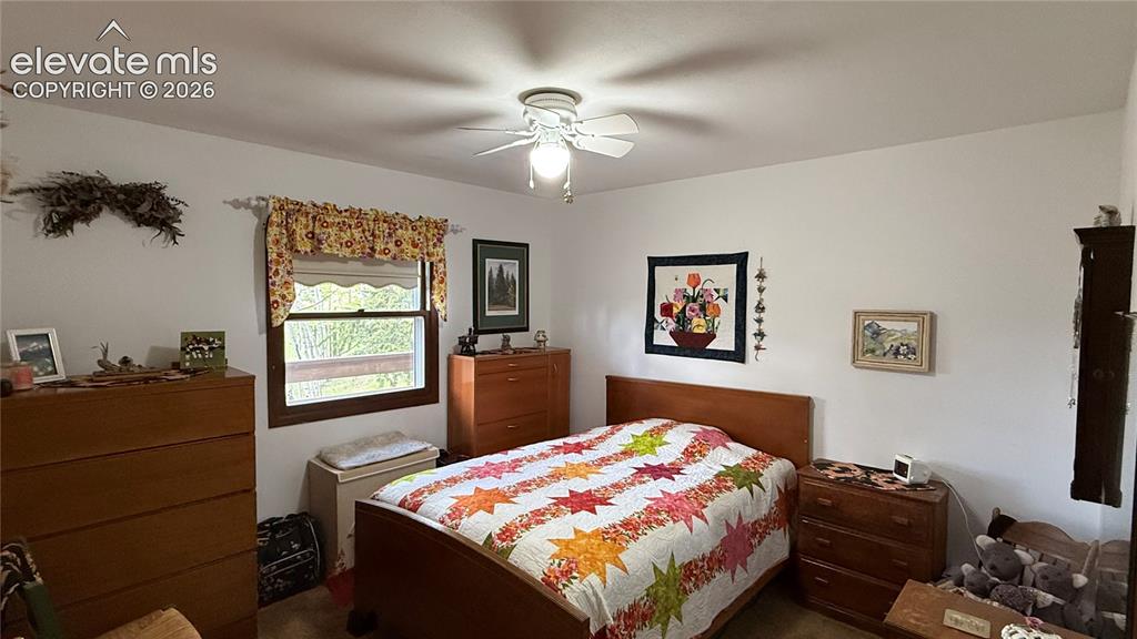 Image 13 of 38: Interior room featuring white walls, a single window with a dark wood frame