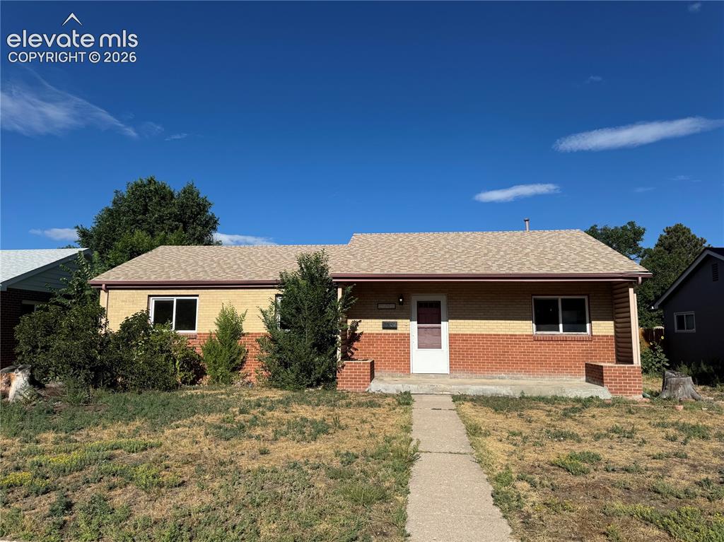 Caption: Single-story residence featuring a brick exterior