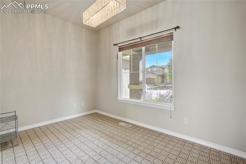 Image 15 of 50: Spare room featuring baseboards