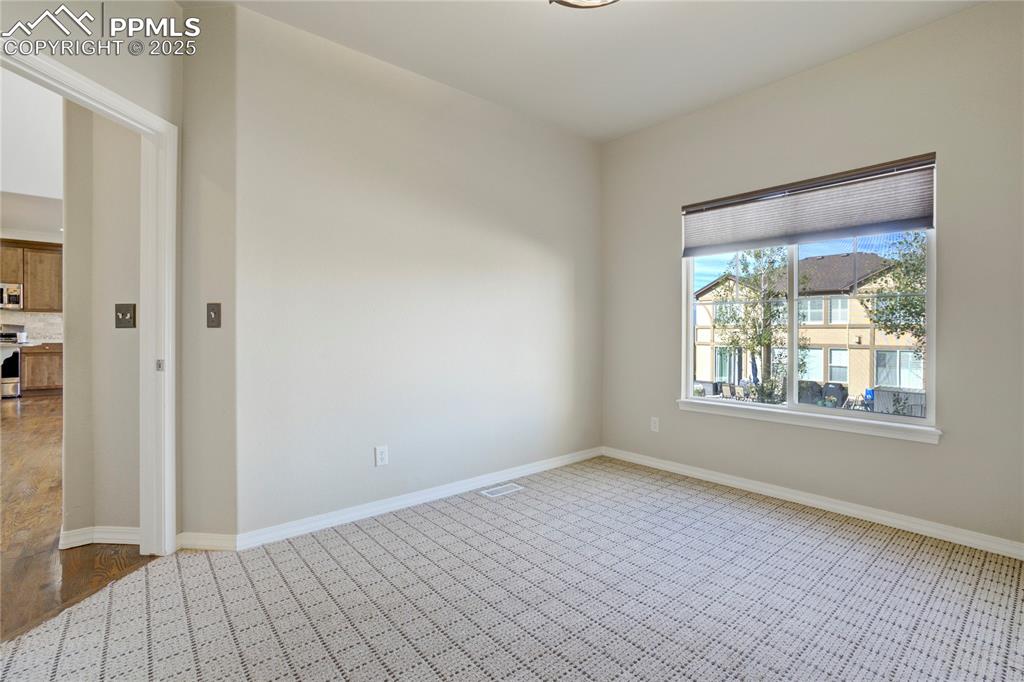 Image 17 of 50: Empty room featuring baseboards