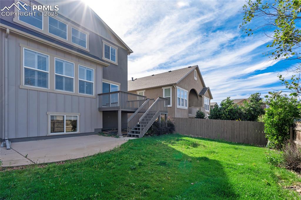 Image 40 of 50: View of yard featuring stairs and a deck