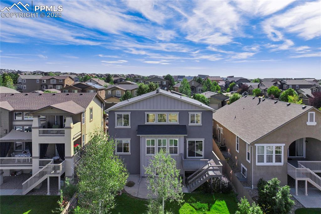 Image 41 of 50: Rear view of house with stairway, stucco siding, a patio, a balcony, and a 