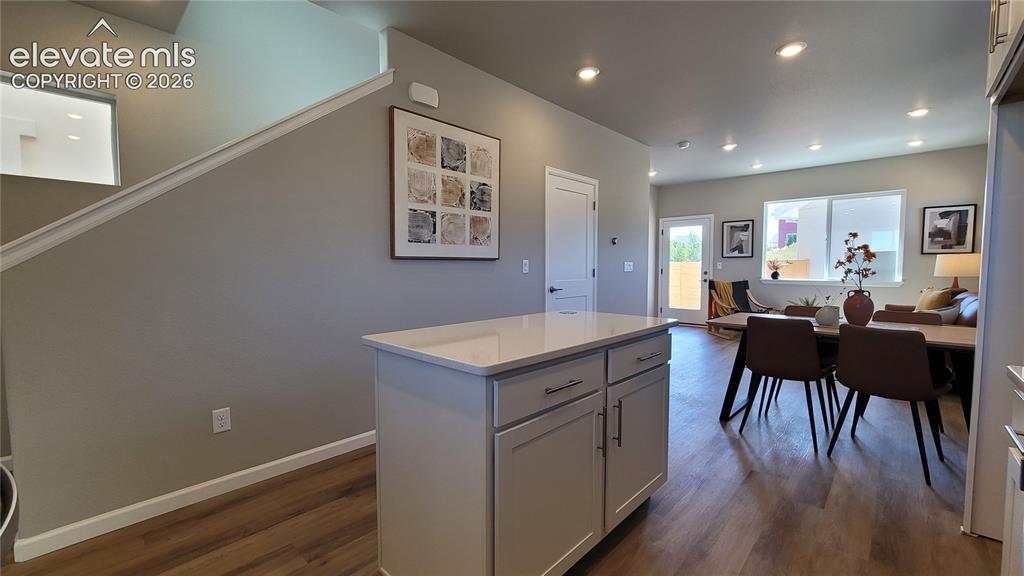 Image 10 of 41: Kitchen island with additional cabinetry and drawers!