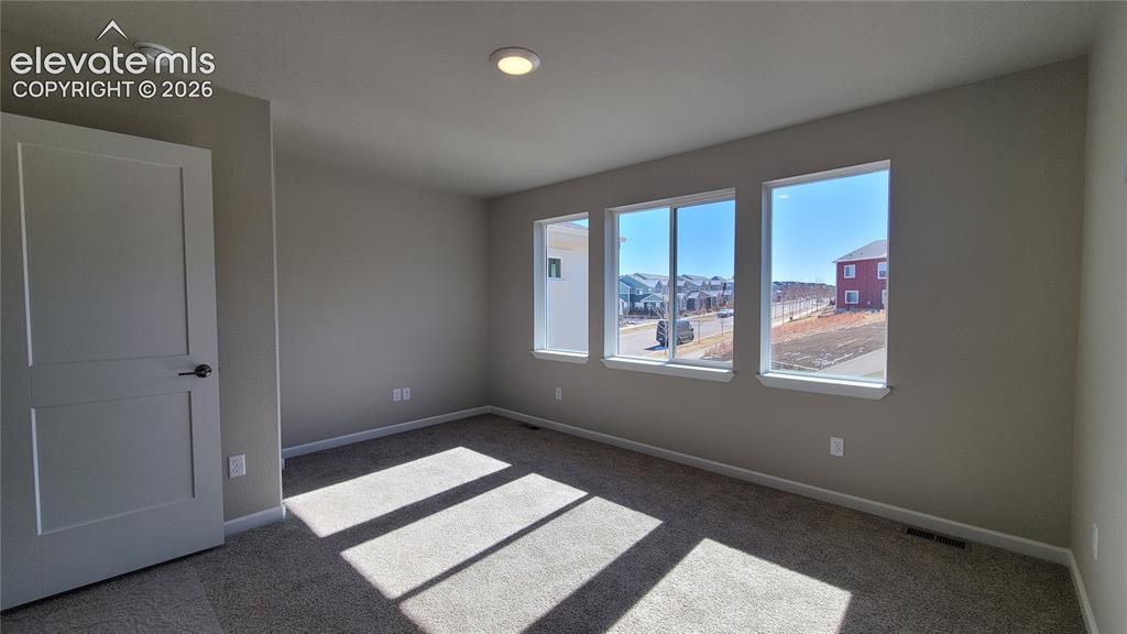 Image 11 of 25: Primary Suite is accompanied with a plush bathroom and walk-in closet!