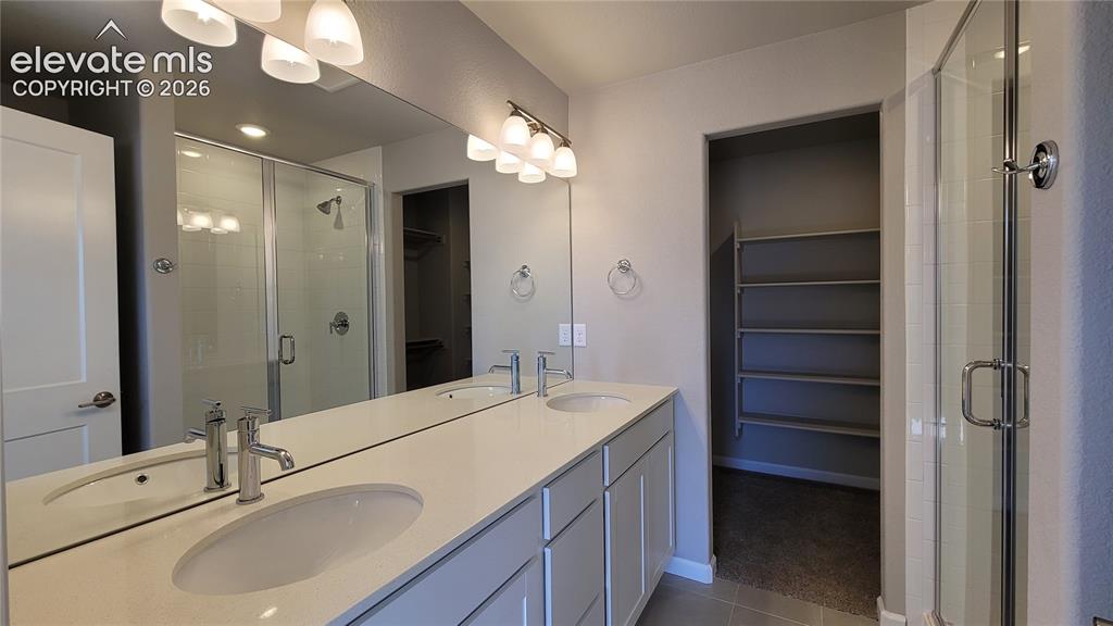Image 13 of 25: Primary Suite is accompanied with a plush bathroom and walk-in closet!