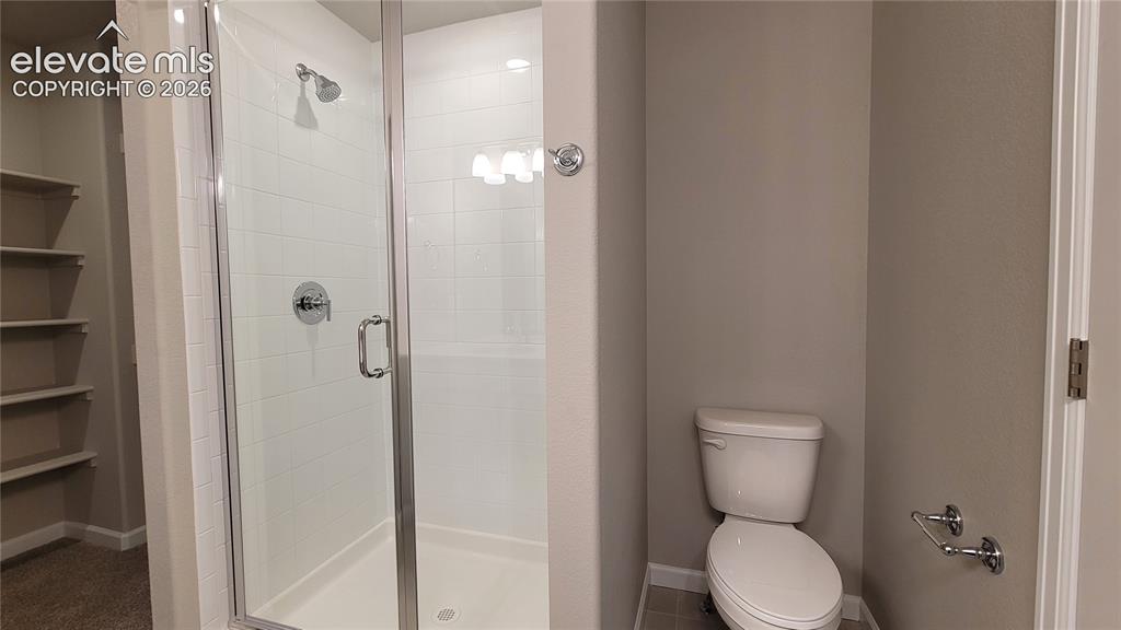 Image 14 of 25: Primary Bathroom with double vanities, quartz countertops, and shower!