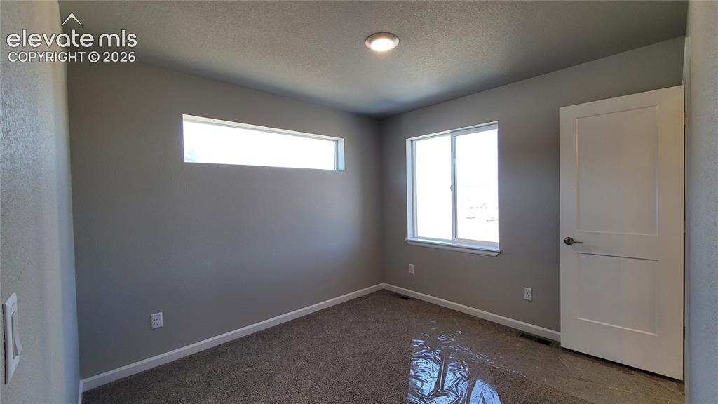 Image 17 of 25: Secondary Suite with full bathroom and walk-in closet!