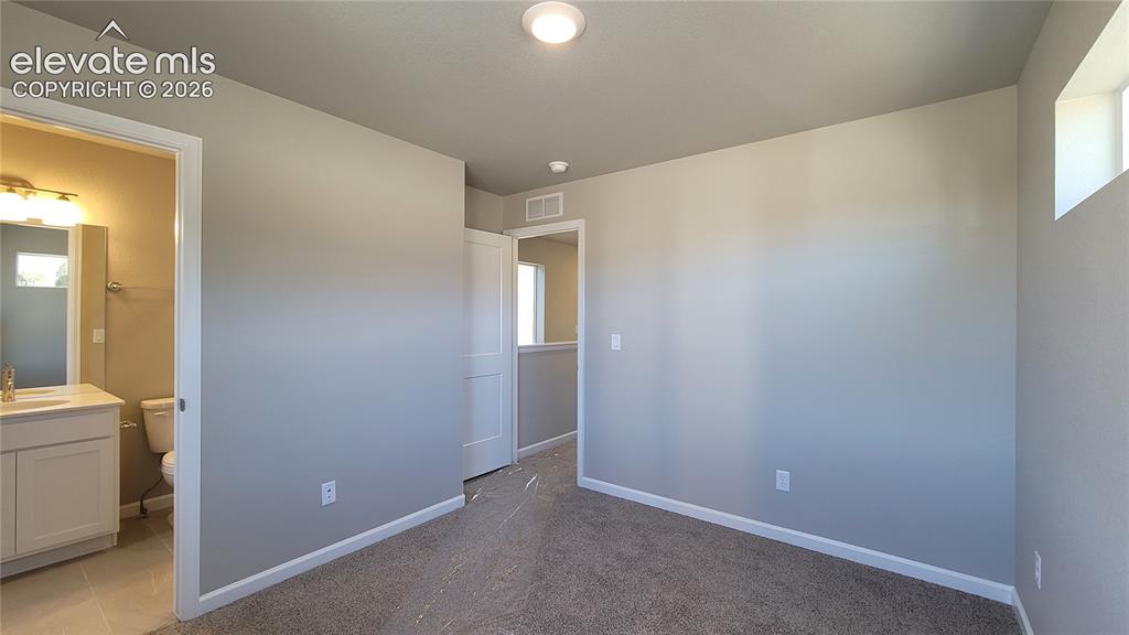 Image 18 of 25: Secondary Suite with full bathroom and walk-in closet!