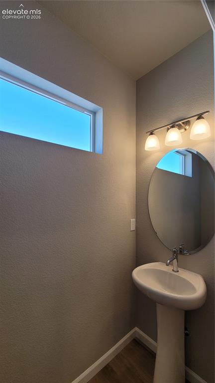 Image 8 of 25: Living Room with LVP flooring, plenty of natural light, LED lighting, and w