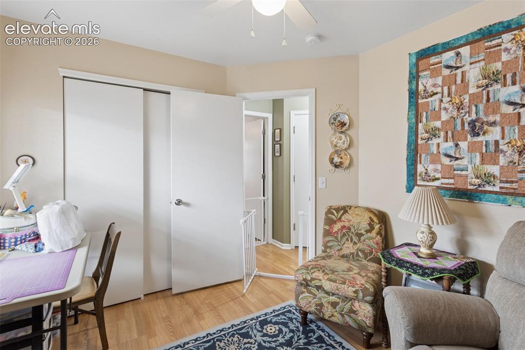 Image 18 of 32: Neutral walls with wood-finish flooring