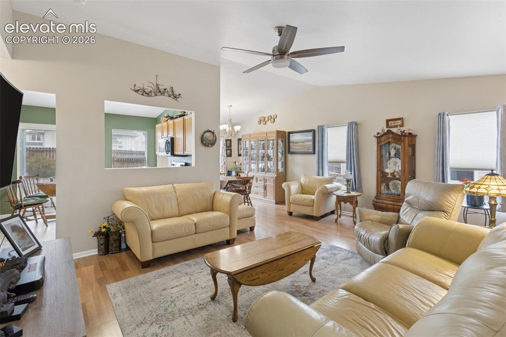 Image 5 of 32: Spacious living showcasing abundant natural light from multiple windows and