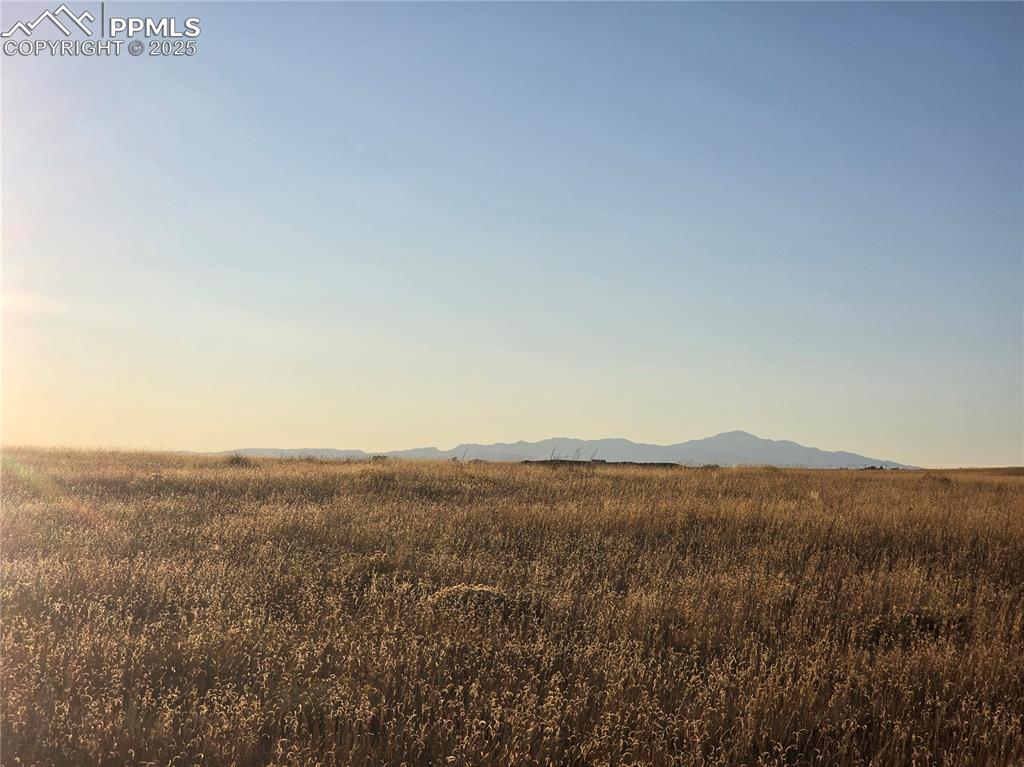 Image 2 of 3: Mountain view with rural landscape