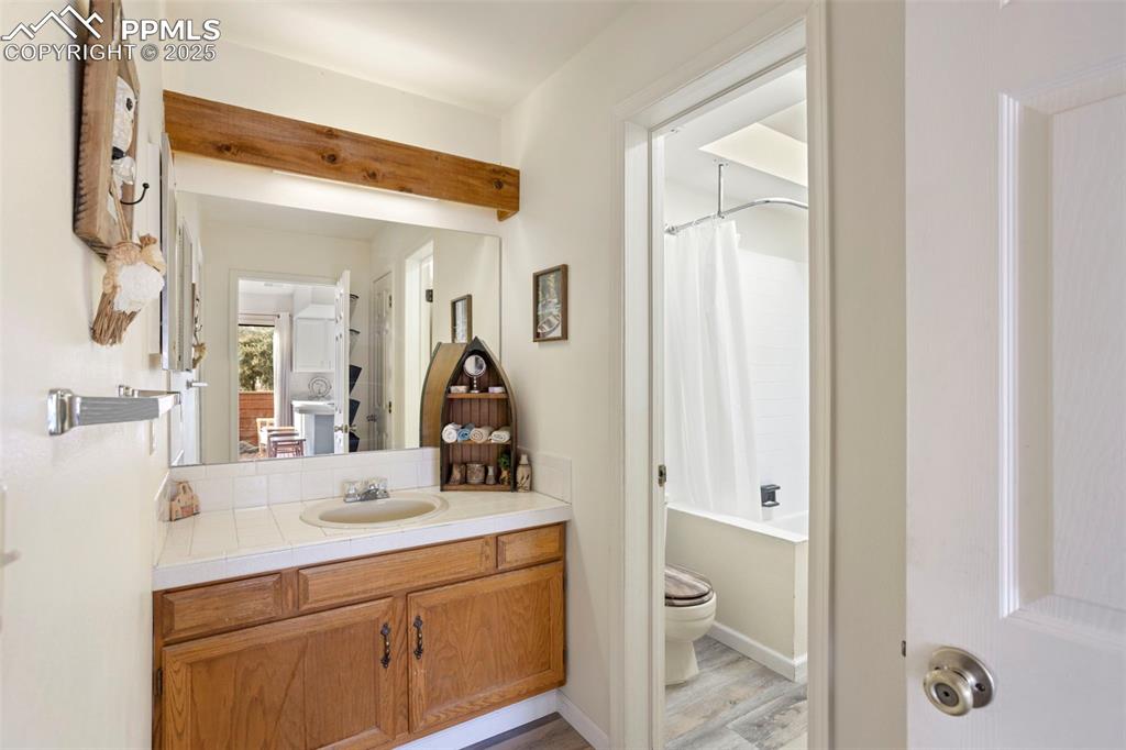 Image 19 of 24: Vanity area-main/2nd bdrm with pass through full bath 