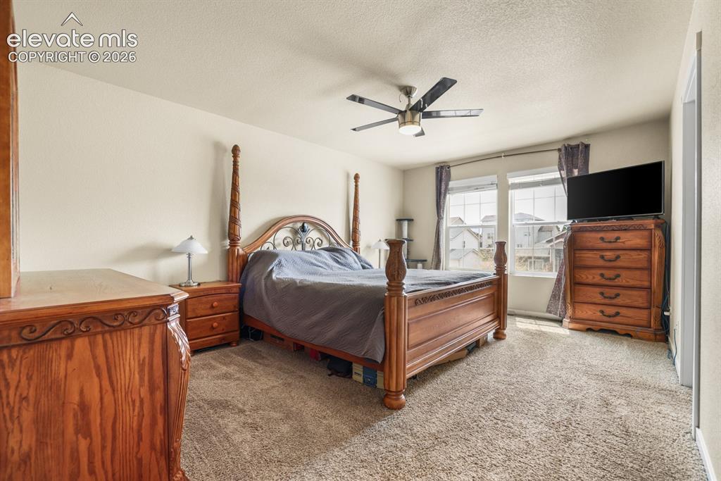 Image 36 of 44: Spacious room featuring neutral carpeting, light-colored walls, and a ceili