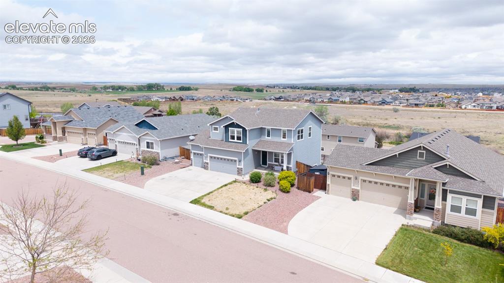 Image 9 of 44: Residential neighborhood featuring varied single-family homes with concrete