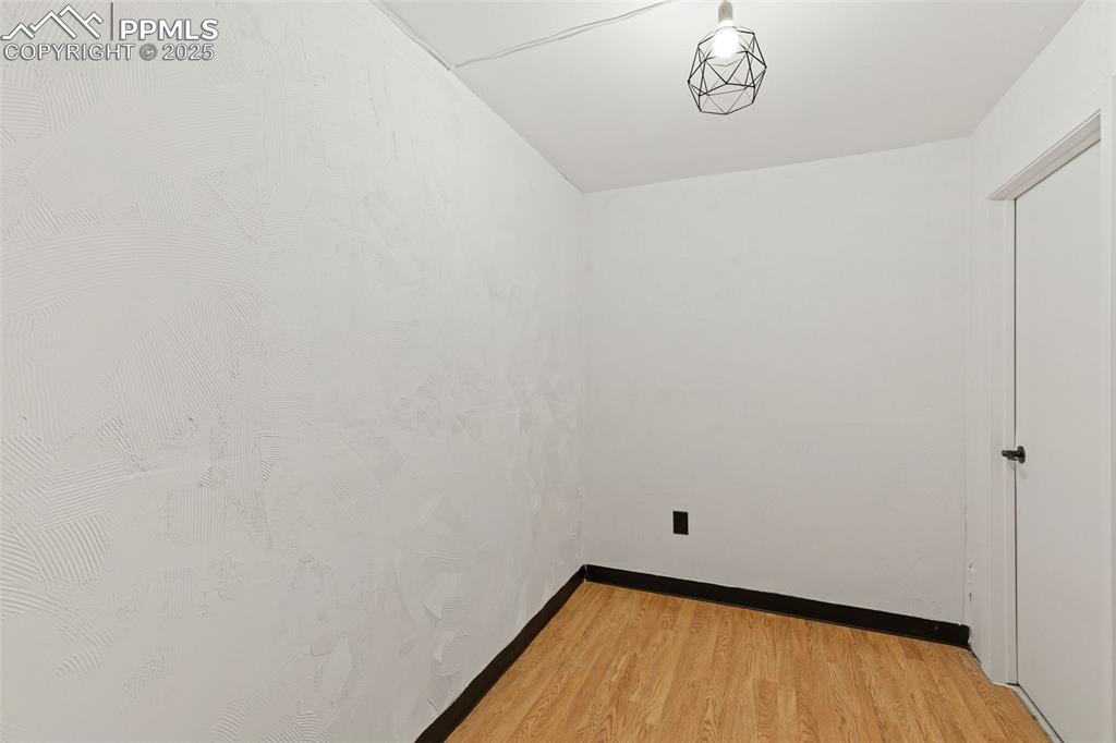 Image 35 of 44: Spare room featuring light wood-style floors and baseboards