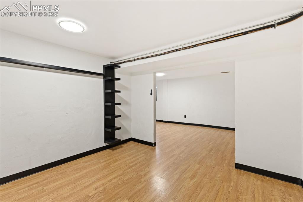 Image 38 of 44: Spare room featuring light wood-style flooring and baseboards