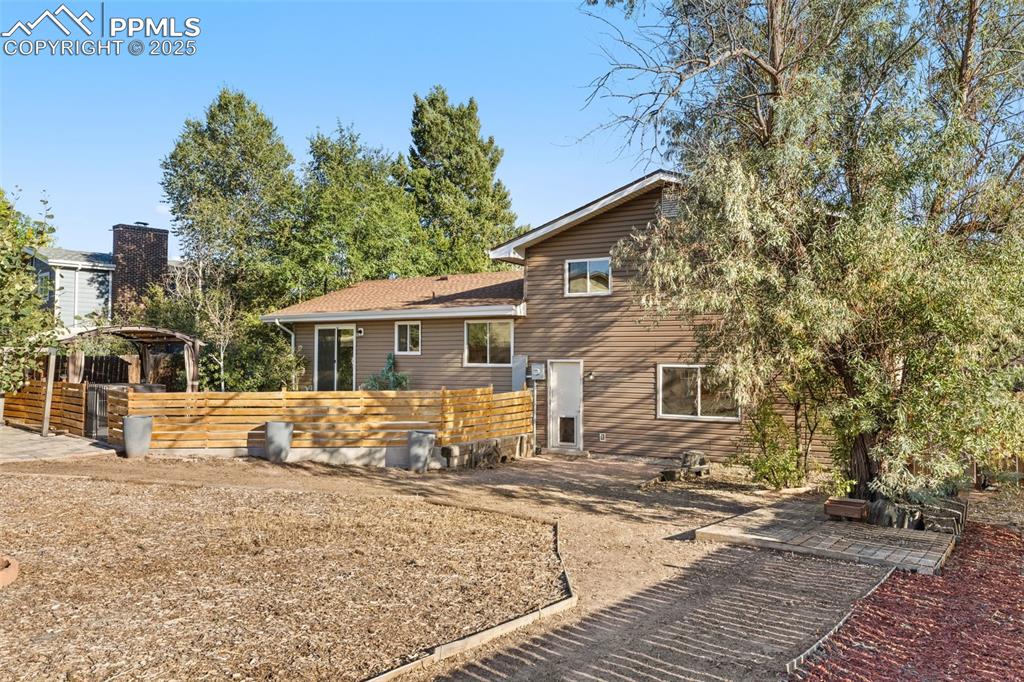 Image 44 of 44: Back of property featuring a patio