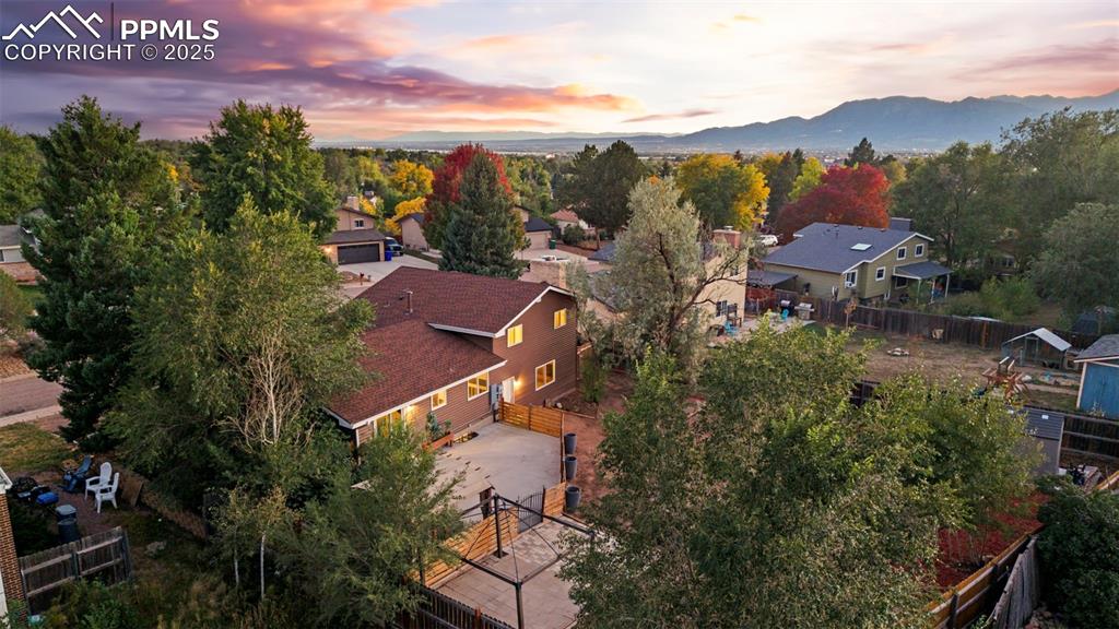 Image 8 of 44: Aerial perspective of suburban area featuring mountains