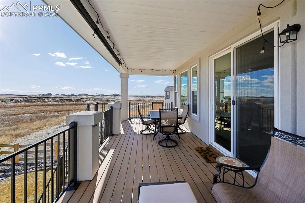 Image 16 of 49: Deck featuring outdoor dining area