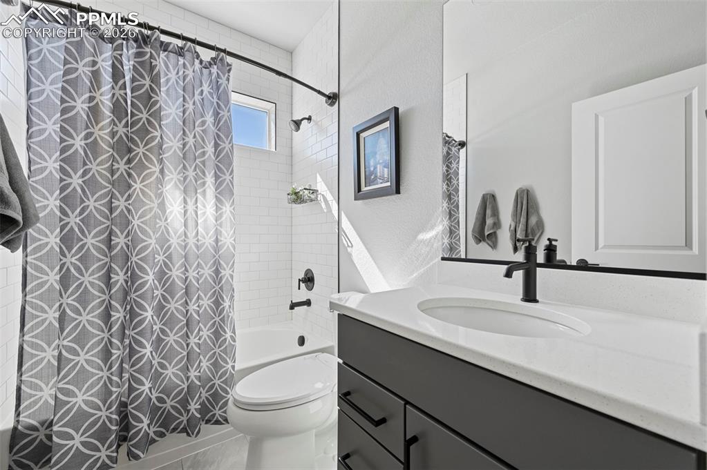 Image 28 of 49: 2nd Main Level Bathroom with vanity, shower / bath combo with shower curtai