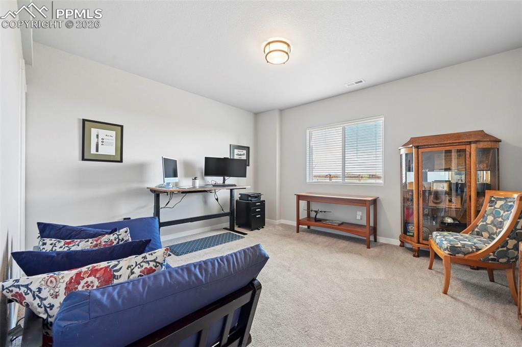 Image 38 of 49: 4th Bedroom - Office space with light colored carpet and baseboards