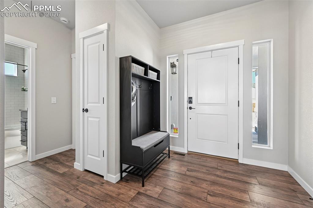 Image 5 of 49: Mudroom with dark wood-style flooring