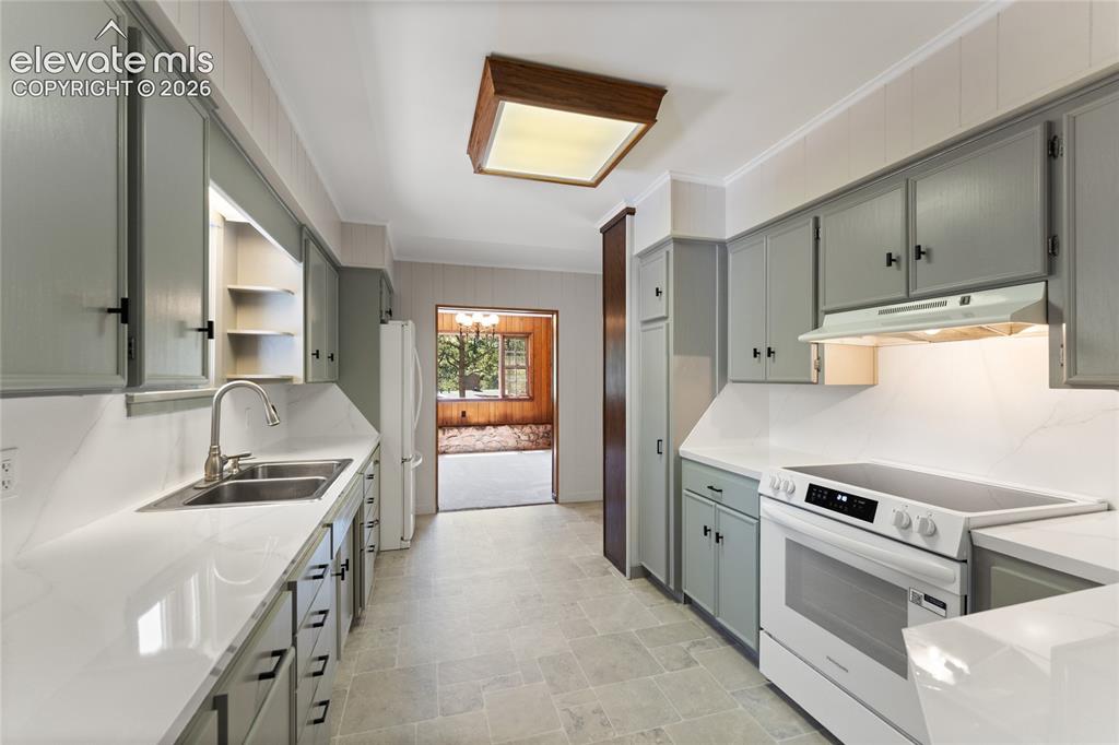 Image 14 of 39: Bright and open kitchen looking toward the dining room
