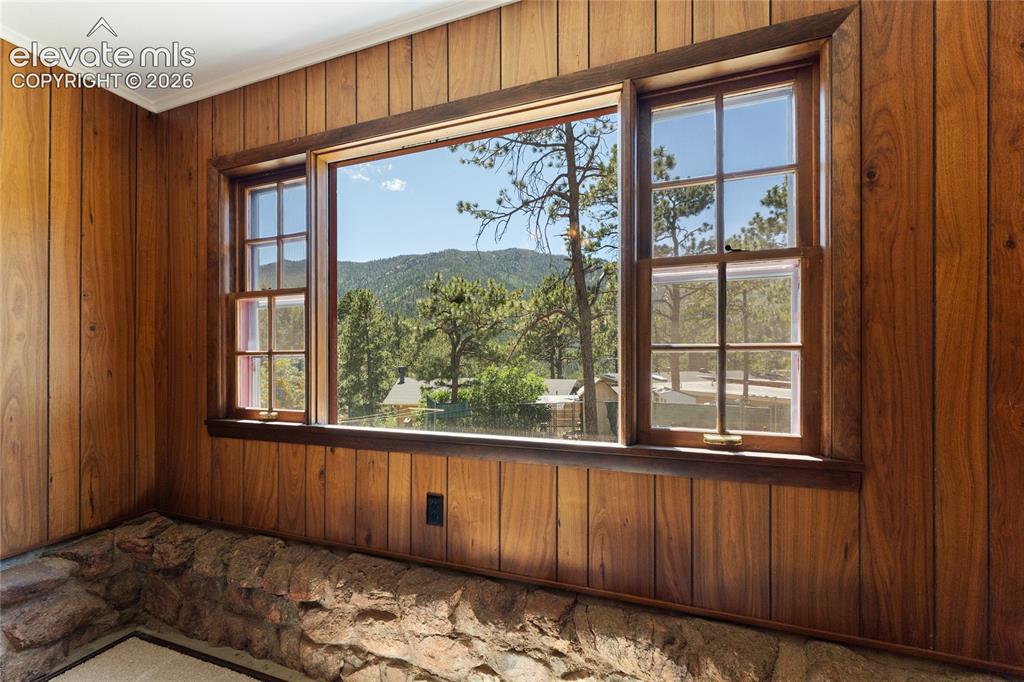 Image 16 of 39: Old stone foundation coming up around the dining window