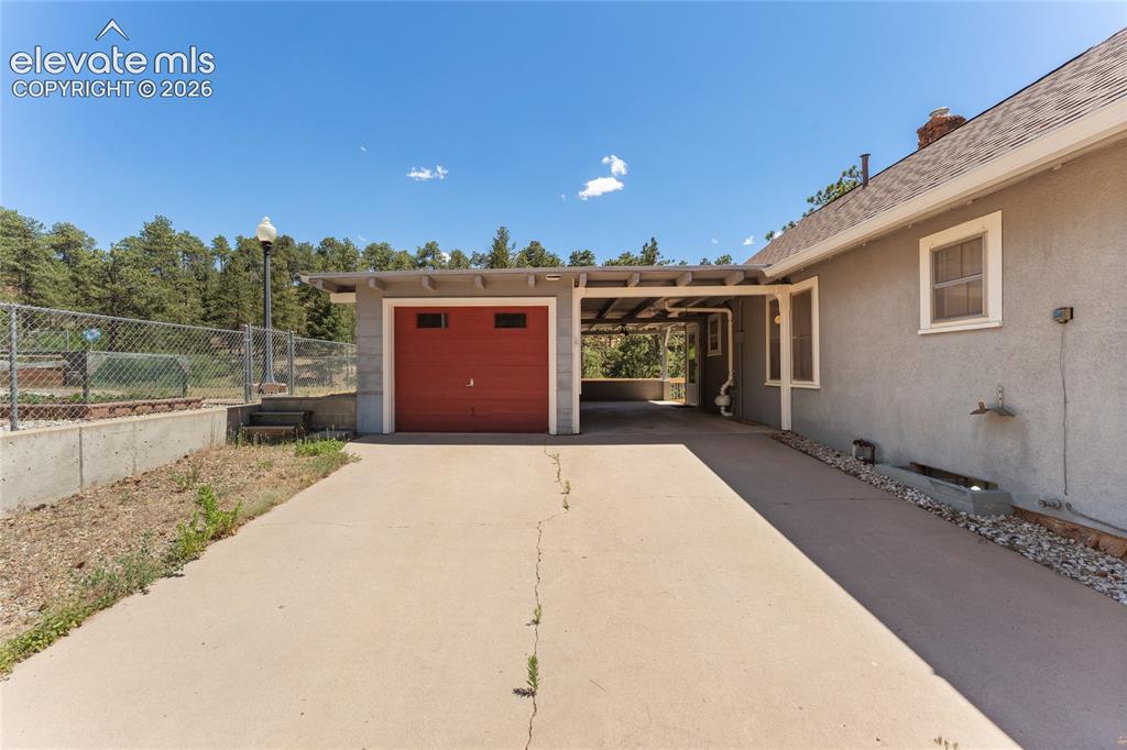 Image 3 of 39: One car garage with room for a workshop at front end