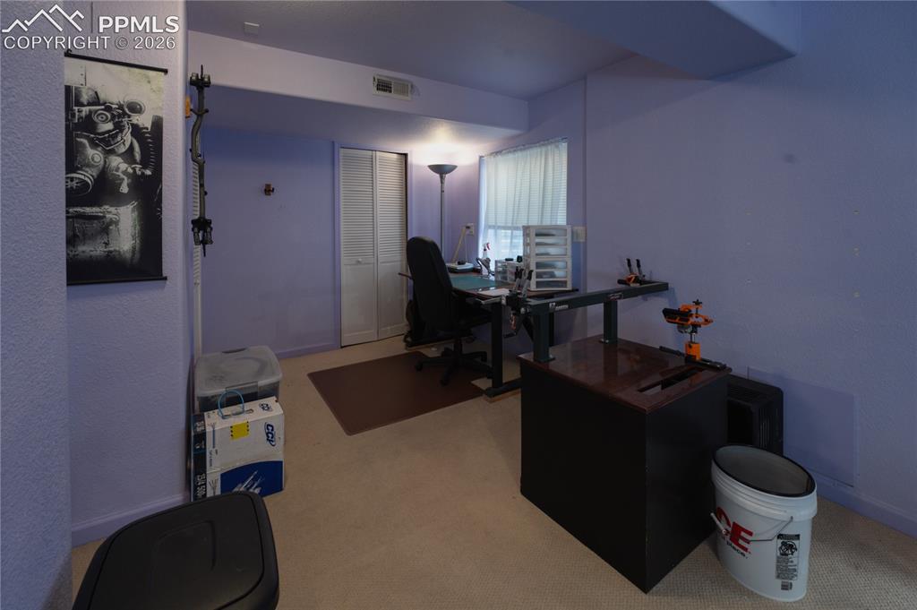 Image 34 of 45: Room featuring light purple wall paint, beige carpet flooring, and a window