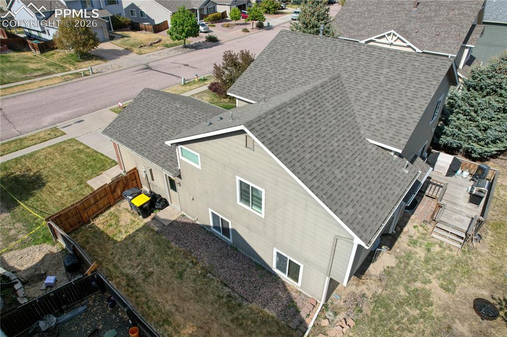Image 44 of 45: Asphalt shingle roofing over the main structure and garage