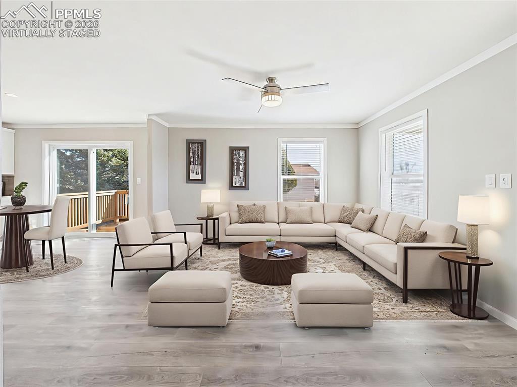 Image 11 of 50: Virtually Staged Family Room – Shown here with a large sectional and accent