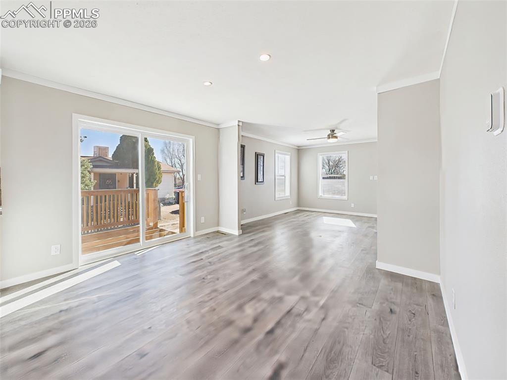 Image 16 of 50: Unstaged Dining & Living Areas – A flexible open-concept area with neutral