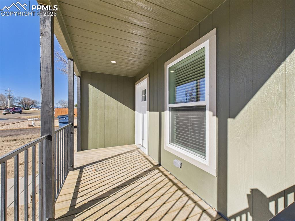 Image 43 of 50: Front Porch (Unstaged) – Covered and elevated, the front entry features cle