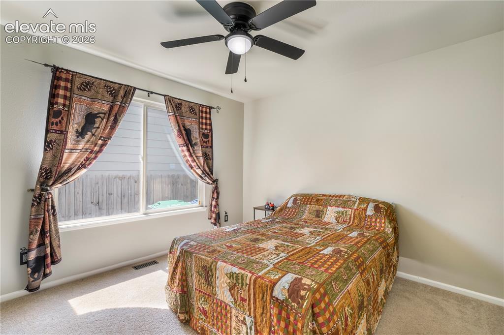 Image 18 of 50: Main level 1st bedroom off of family room