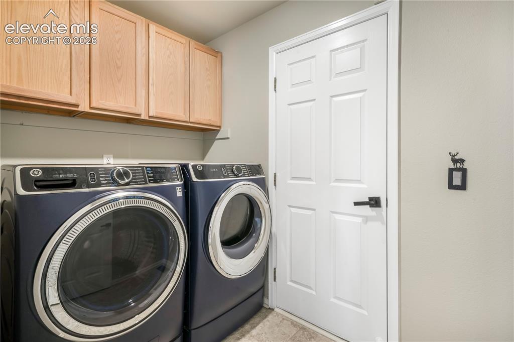 Image 21 of 50: Main level laundry room with access to 2 car garage