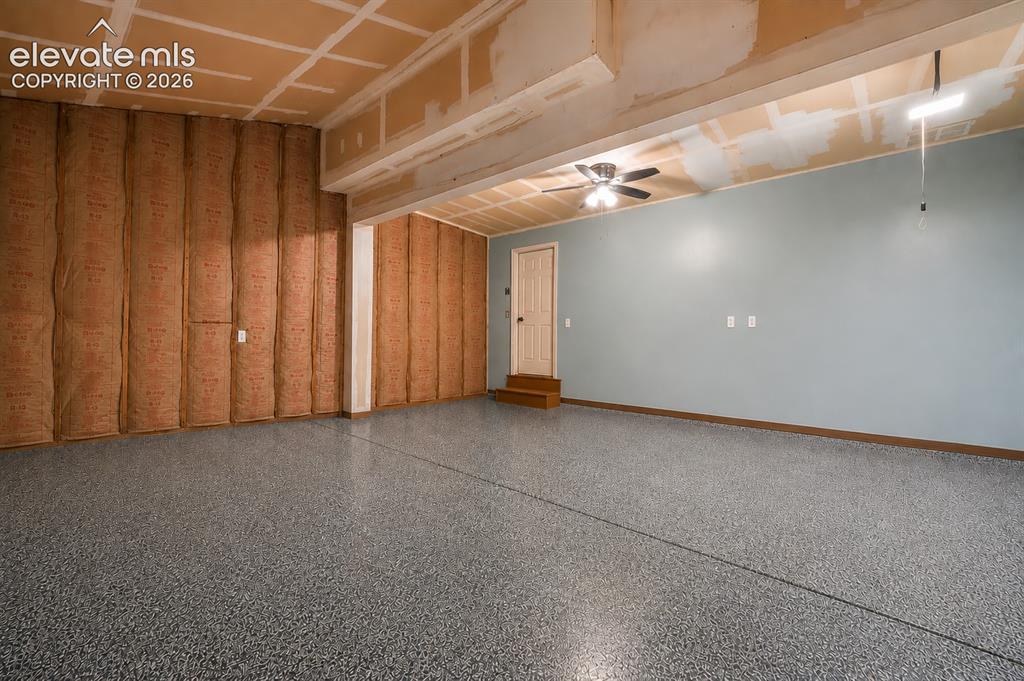 Image 22 of 50: 2 car garage with epoxy floors