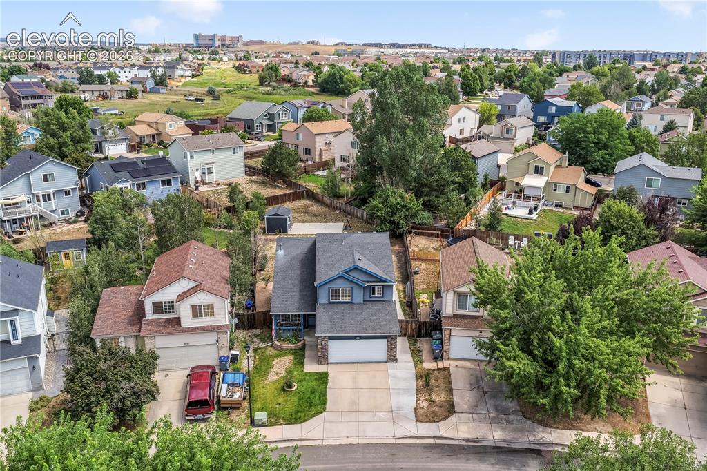 Image 3 of 50: Aerial view of front of home on large lot