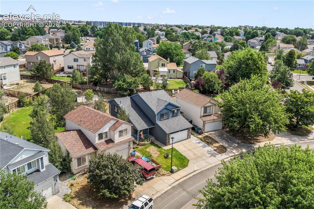 Image 4 of 50: Aerial view of front of home on large lot