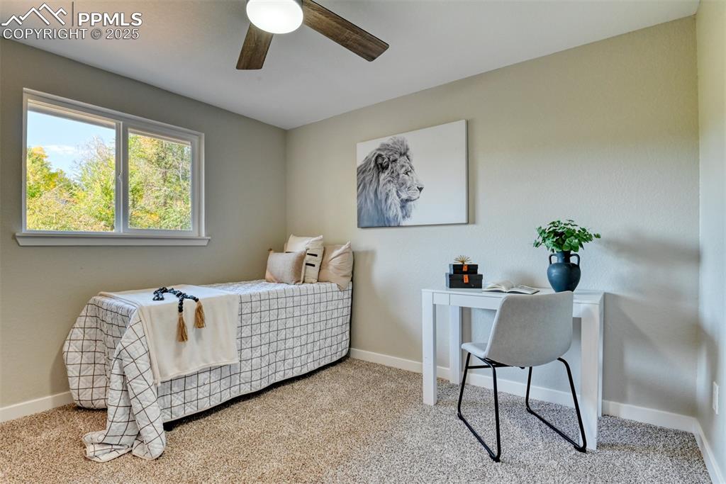 Image 23 of 48: Bedroom featuring light carpet and a ceiling fan