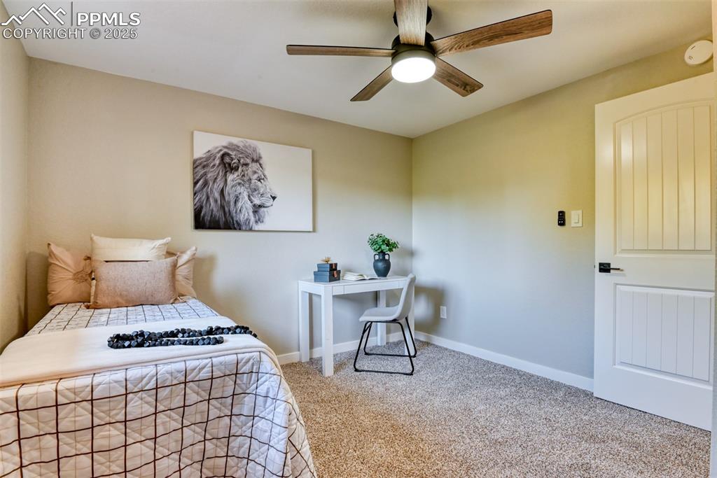 Image 25 of 48: Bedroom with carpet floors and ceiling fan