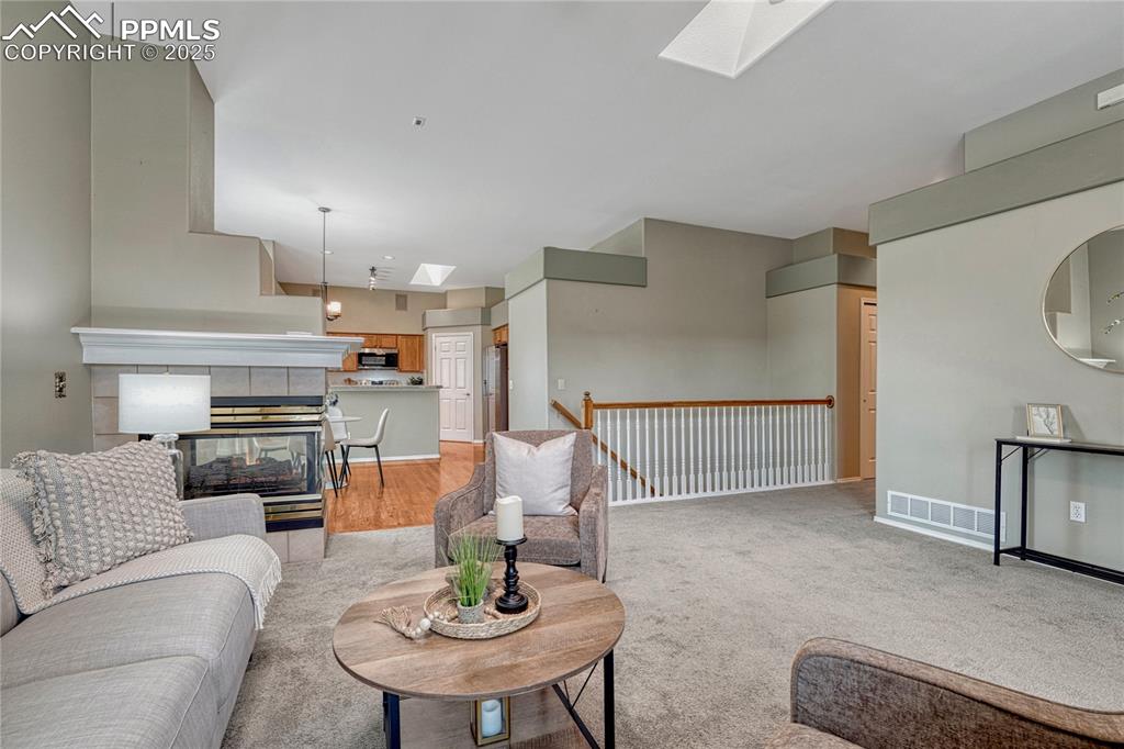 Image 16 of 47: Hallway ahead and to right leads to large half bath