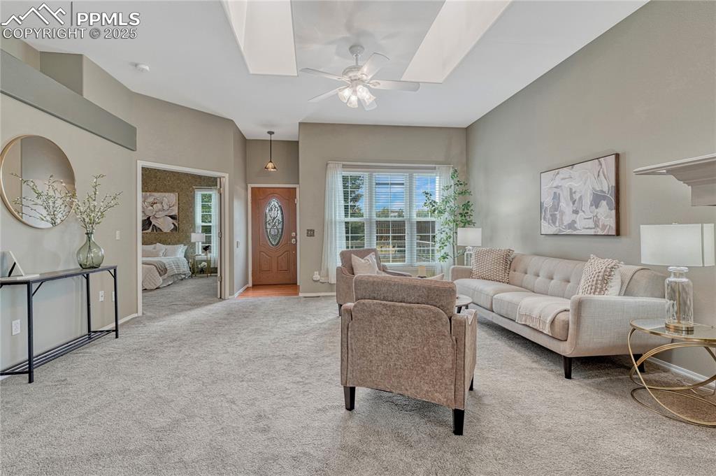 Image 25 of 47: View of living area, entry, and French doors leading to large Primary Bedro