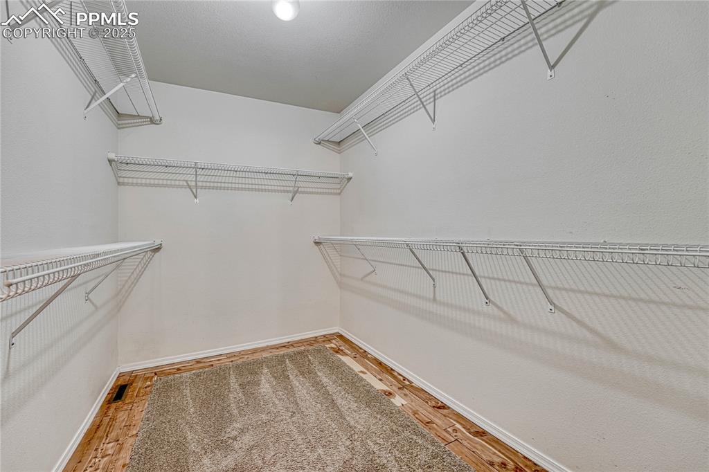 Image 31 of 47: Walk-in closet with cedar lined floor