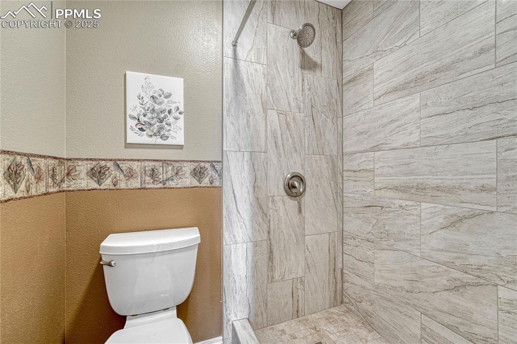 Image 7 of 47: Primary bath with tiled shower